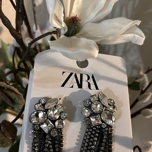 Statement earrings about 4 1/2” long. Glass pendants.